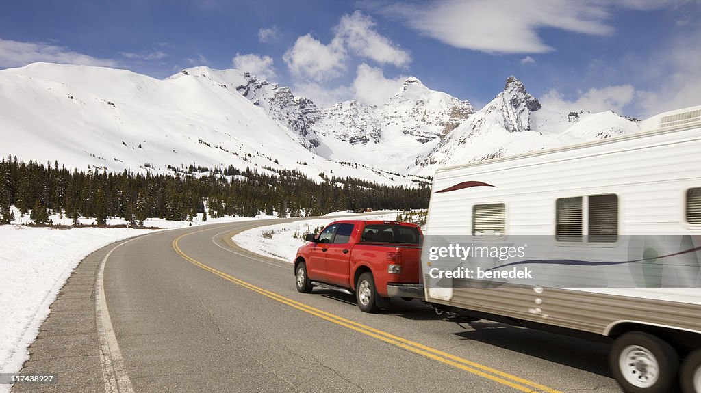 Car and travel trailer in the mountains