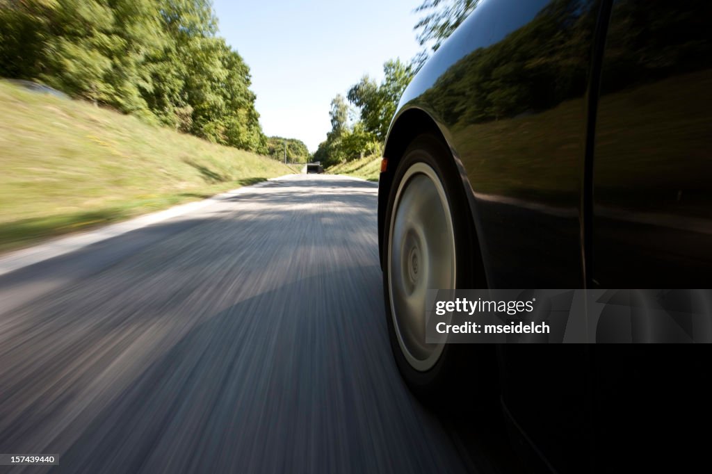 Outside view of a car driving down the street