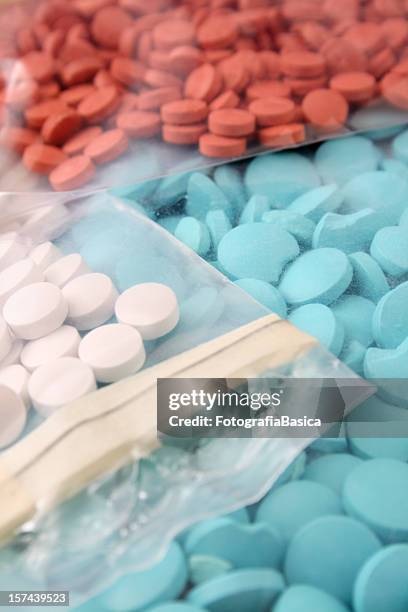 pills in plastic bags - mdma stock pictures, royalty-free photos & images