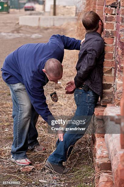 plainclothes cop arresting young thug - teen arrest stock pictures, royalty-free photos & images