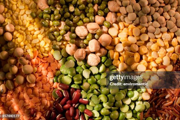 assorted bean, pea and grain background. - lentil stock pictures, royalty-free photos & images