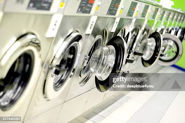 washing machines in a public launderette - dry cleaned stock pictures, royalty-free photos & images
