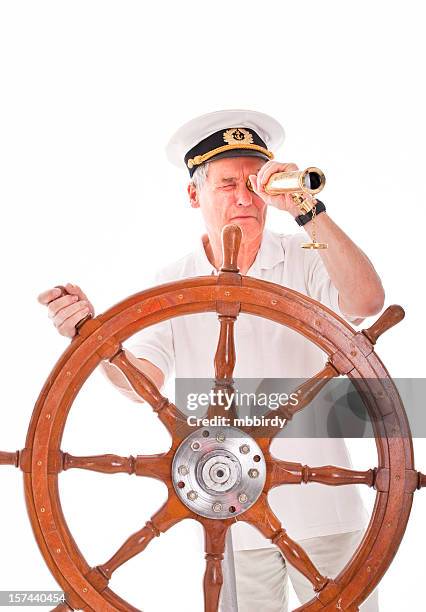 senior sailor with telescope - skipper stockfoto's en -beelden