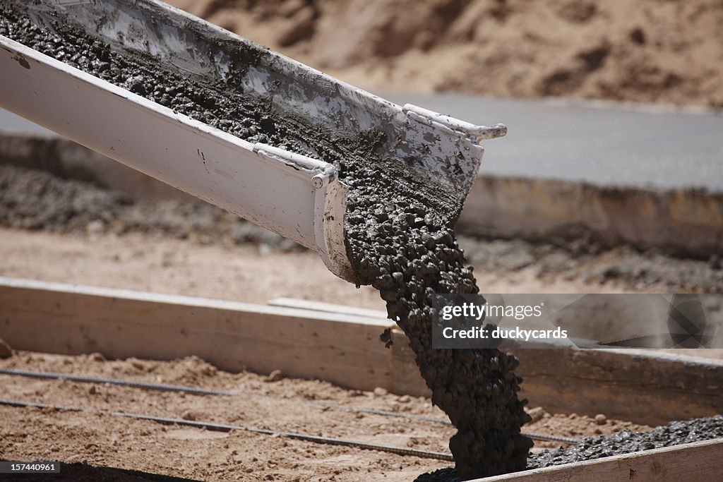 Cement Pouring From A Mixer Truck Chute High-Res Stock Photo