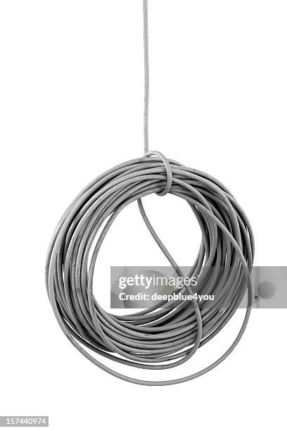 hanging isolated cable coil on building site isolated - rope length stock pictures, royalty-free photos & images