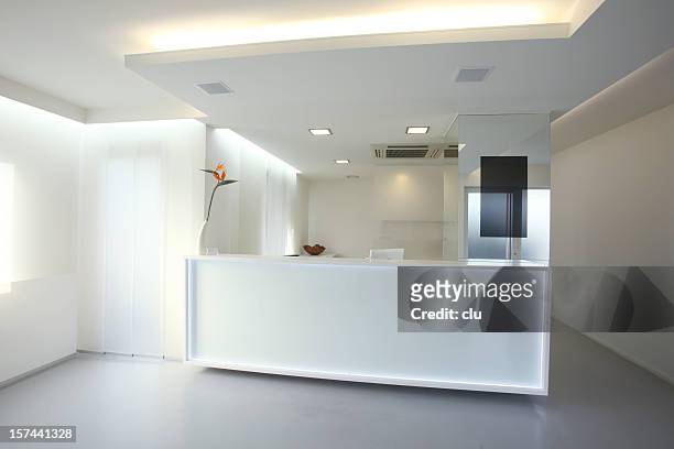 modern reception desk in grey white color (xxxl) - ceiling light stockfoto's en -beelden
