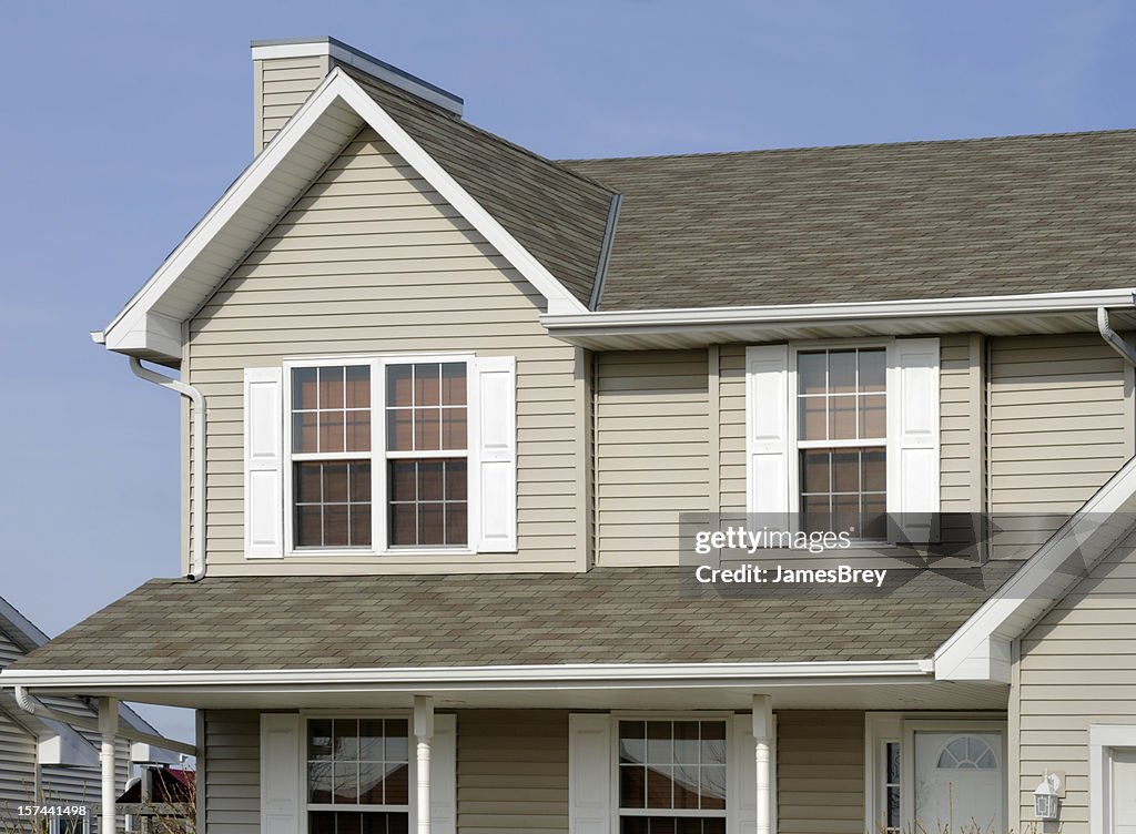 Residential Home With Vinyl Siding, Gable Roof, Seamless Gutters, Shutters