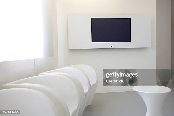 emtpy lobby room with tv screen on the wall - lobby screen stock pictures, royalty-free photos & images