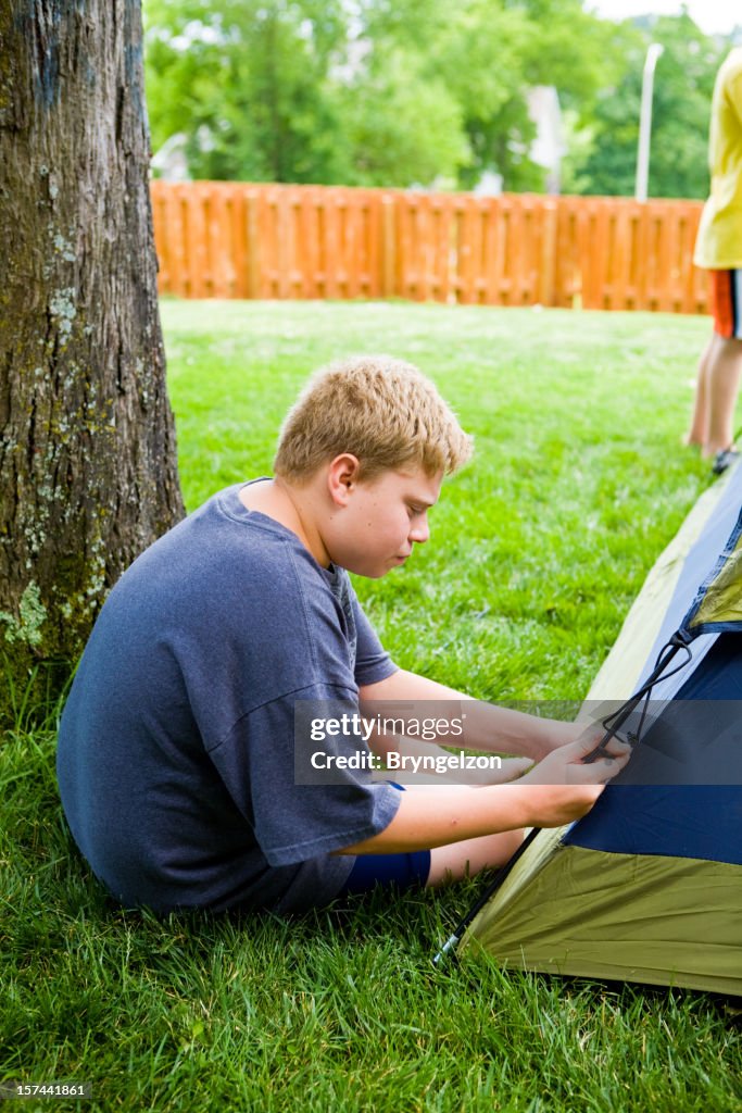 Boys Putting Tent Up in Backyard