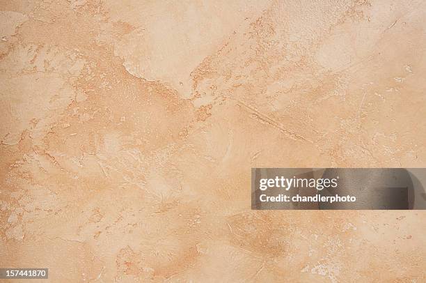 a tan, marble, vintage background - stucwerk stockfoto's en -beelden