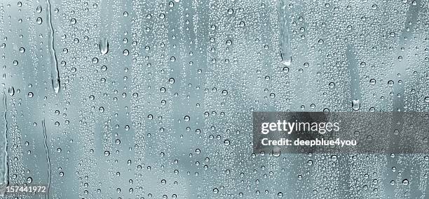 water drops on a window - morning dew stockfoto's en -beelden
