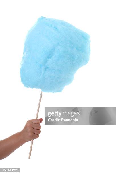 a hand holding blue cotton candy - cotton candy stock pictures, royalty-free photos & images