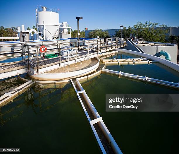 wide angle view of water purification plant - water plant stock pictures, royalty-free photos & images