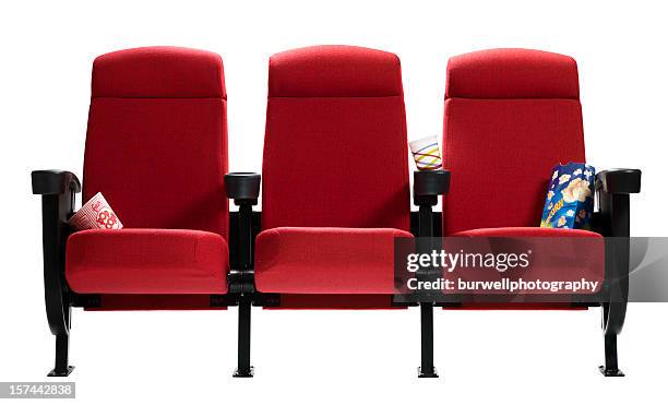 three theater seats with popcorn bags, isolated - stoel stockfoto's en -beelden