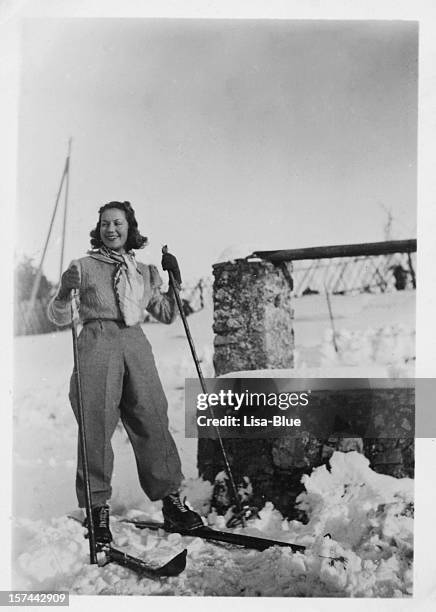 young woman with ski. winter holidays, 1935. black and white - woman skiing stock pictures, royalty-free photos & images