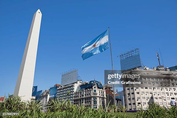 argentina buenos aires obelisco with argentine flag - buenos aires bildbanksfoton och bilder