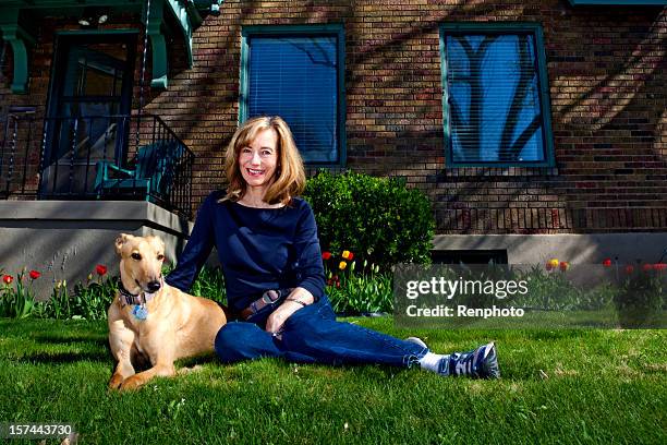 mature woman portrait with her dog - lady greyhound stock pictures, royalty-free photos & images