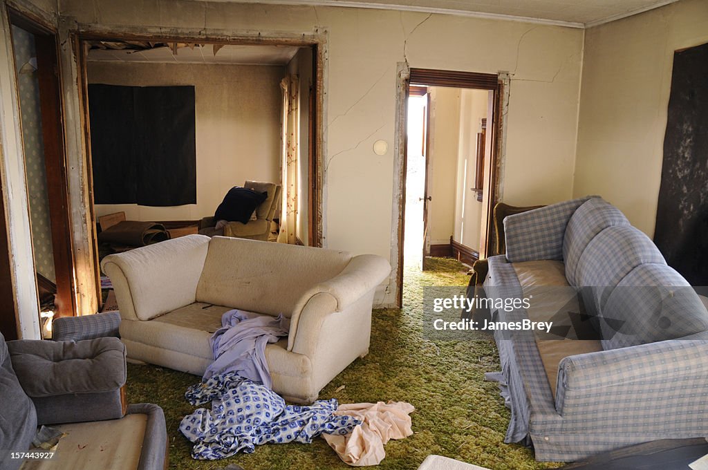 Destroyed Home; Damaged by Looting, Earth Quake, or Flooding