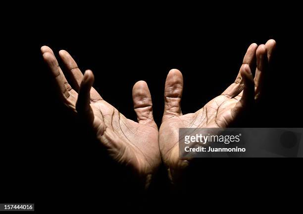 hands to heaven - christianity black background stock pictures, royalty-free photos & images
