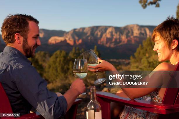 toasting with wine outdoors - sedona stockfoto's en -beelden