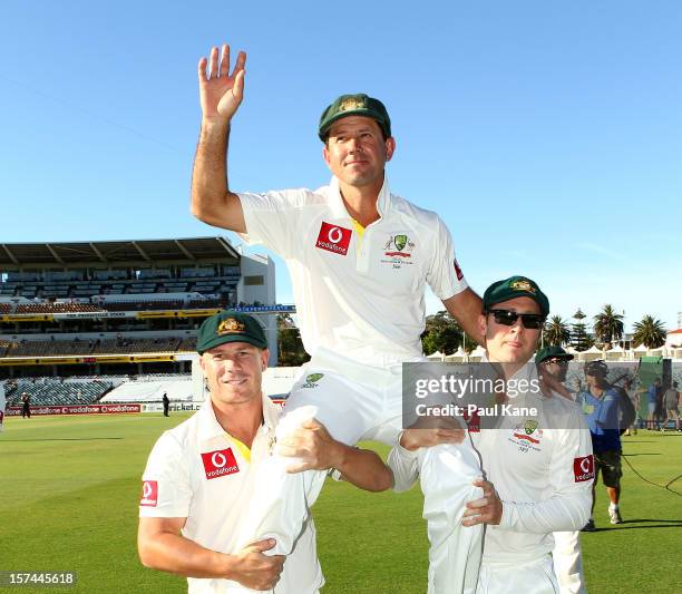 Ricky Ponting of Australia is chaired from the ground by David Warner and Michael Clarke after retiring from International cricket during day four of...