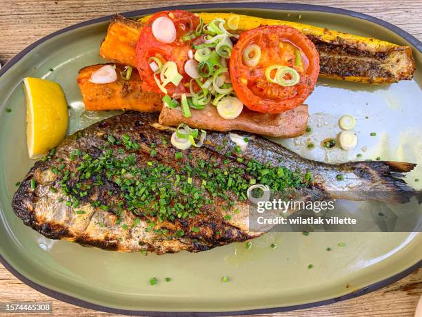 grilled and tomato salad. - snapper fish stock pictures, royalty-free photos & images