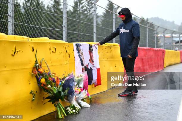 Zhou Guanyu of China and Alfa Romeo F1 lays a wreath in tribute to the late Anthoine Hubert during previews ahead of the F1 Grand Prix of Belgium at...