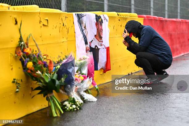 Zhou Guanyu of China and Alfa Romeo F1 lays a wreath in tribute to the late Anthoine Hubert during previews ahead of the F1 Grand Prix of Belgium at...