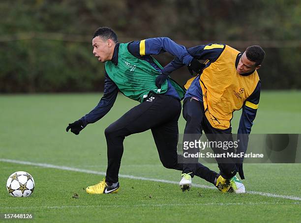 Francis Coquelin and Martin Angah of Arsenal during a training session at London Colney on December 03, 2012 in St Albans, England.
