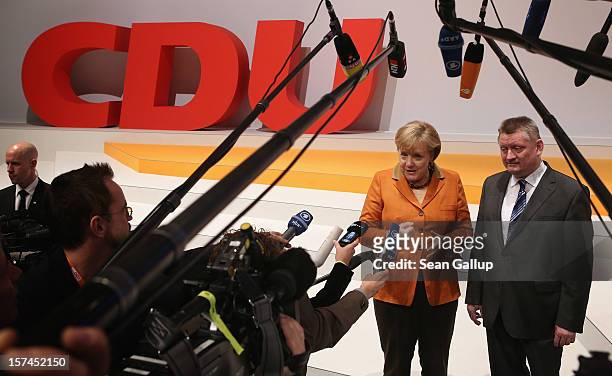 German Chancellor Angela Merkel, who is also chairwoman of the German Christian Democratic Union , speaks to the media with CDU General Secretary...
