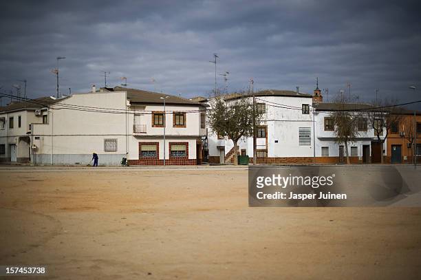 Man sweeps the street on November 30, 2012 in Villacanas, Spain. During the boom years, where in its peak Spain built some 800,000 houses a year...