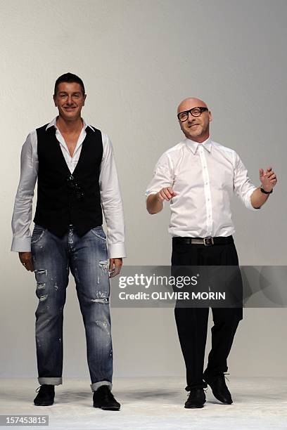 This file picture taken on June 18, 2011 during the Men's fashion week in Milan shows designers Stefano Gabbana and Domenico Dolce acknowledging the...