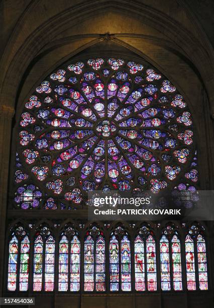 View of the middle-age stained glass rosace on the southern side of the Notre-Dame de Paris cathedral, on November 29 in Paris. AFP PHOTO / PATRICK...