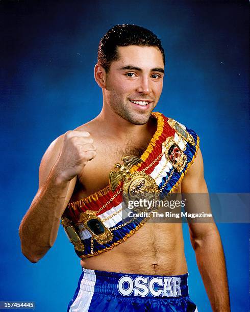 Oscar De La Hoya wears the Ring Belt as he poses as the "Fighter of the Year".