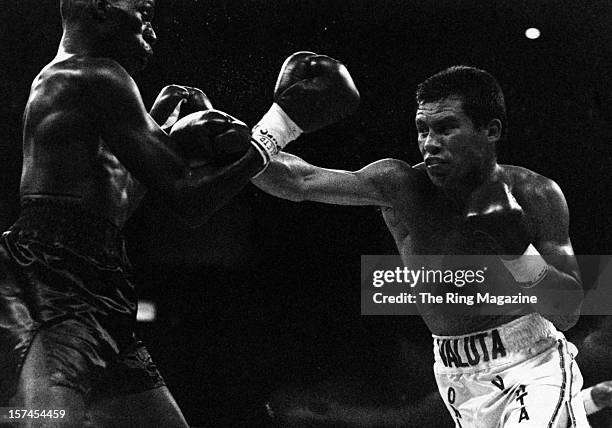 Julio Cesar Chavez throws a right punch to Roger Mayweather during the fight at the Great Western Forum on May 13,1989 in Inglewood, California....