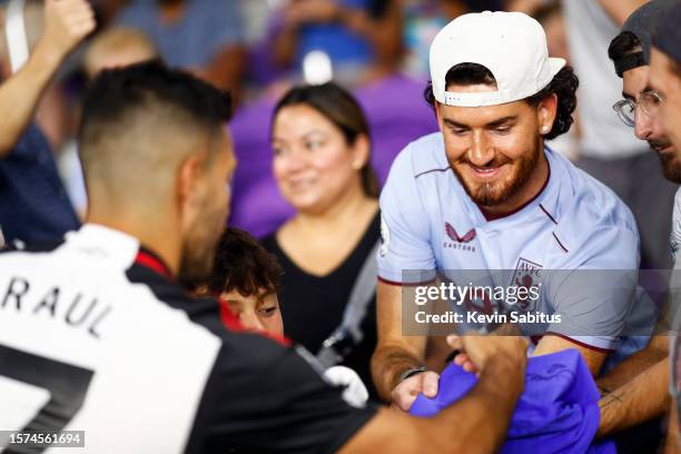 Raúl Jiménez of Fulham signs autographs for fans prior to a match against Aston Villa at Exploria Stadium on July 26, 2023 in Orlando, Florida.