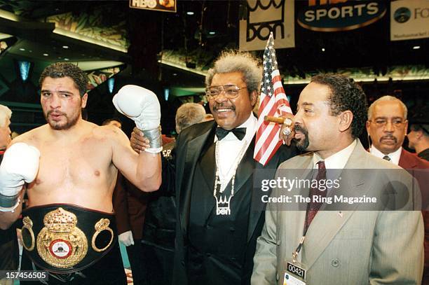 John Ruiz wears the belt as he celebrates with promoter Don King after winning the fight against Evander Holyfield at the Foxwoods Resort, on...