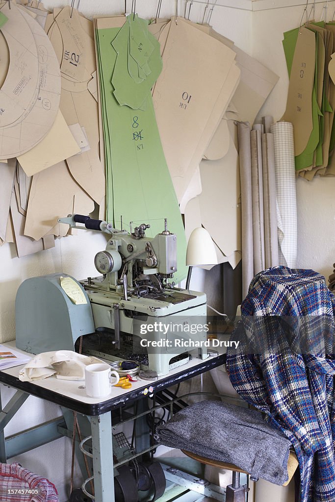 Sewing machine in clothing manufacturers workshop