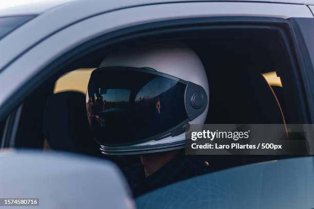 close up of race car driver with helmet and window down,texas,united states,usa - mirror image stock-fotos und bilder