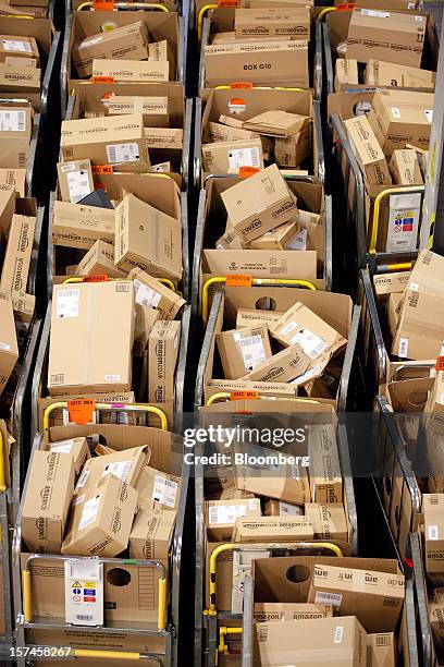 Packages sit in regional delivery dividers ahead of distribution at the Amazon.co.uk Marston Gate 'Fulfillment Center,' the U.K. Site of Amazon.com...