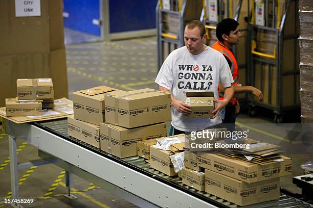 An employee processes customer orders at the Amazon.co.uk Marston Gate 'Fulfillment Center' the U.K. Site of Amazon.com Inc. In Ridgmont, U.K., on...