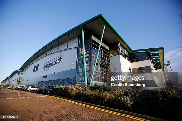 Logo sits on a wall outside the Amazon.co.uk Marston Gate 'Fulfillment Center,' the U.K. Site of Amazon.com Inc., in Ridgmont U.K., on Monday, Dec....