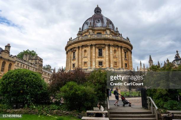 Woman pushes a pram past the Radcliffe Camera on August 3, 2023 in Oxford, England. Oxford's city council proposed a 20-year urban plan for...