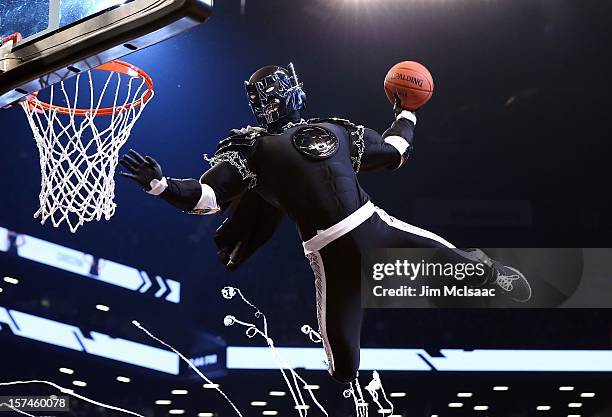 The 'Brooklyn Knight' performs during a break in the game between the Brooklyn Nets and the New York Knicks at Barclays Center on November 26, 2012...
