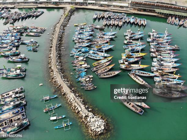 aerial view of fishing boats in a harbour, trenggalek, east java province, indonesia - east java province fotografías e imágenes de stock