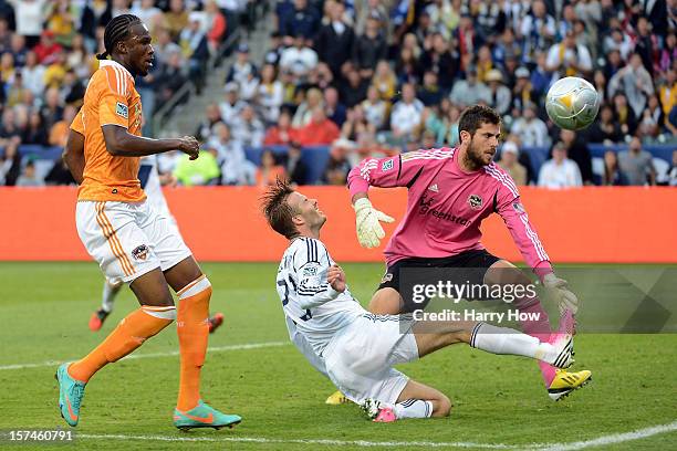 David Beckham of Los Angeles Galaxy attempts a shot on goalie Tally Hall of Houston Dynamo in the second half in the 2012 MLS Cup at The Home Depot...
