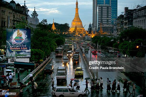 Traffic moves along a busy downtown street November 30, 2012 in Yangon, Myanmar. Business is booming in this newly opened Southeast Asian country....