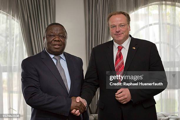 German Development Minister Dirk Niebel shakes hands with zimbawean Prime Minister Morgan Tsvangirai , MDC-T, in his residence on December 3, 2012 in...