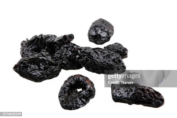 prunes on a white background - dried plum stock pictures, royalty-free photos & images
