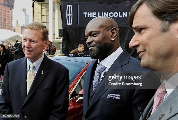 Alan Mulally, president and chief executive officer of Ford Motor Co., from left, former professional football player Emmitt Smith, and Jim Farley,...